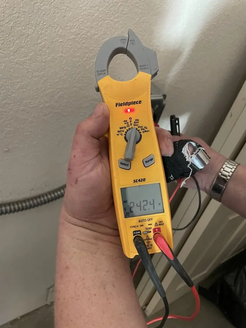 Voltage testing with clamp meter during Whole House Surge Protector in Henryetta